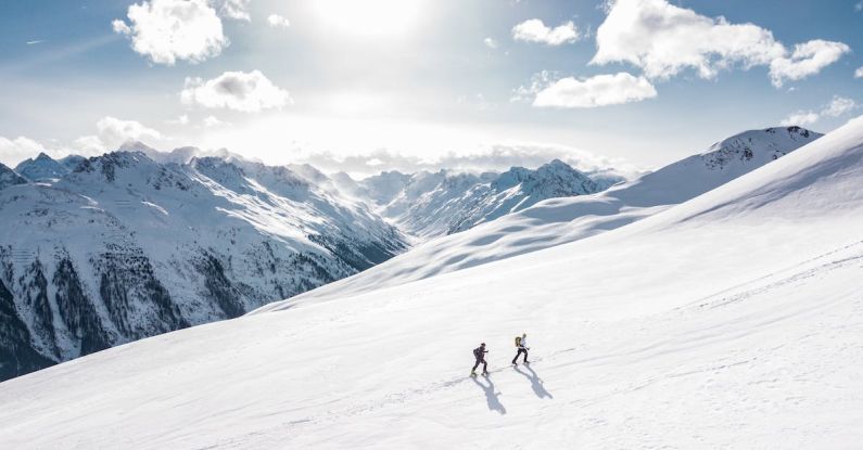 Alpine - Two Man Hiking on Snow Mountain
