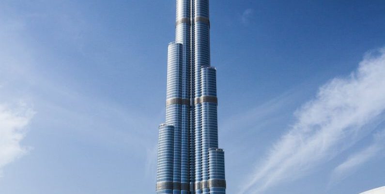Dubai - Blue and Gray High Rise Building