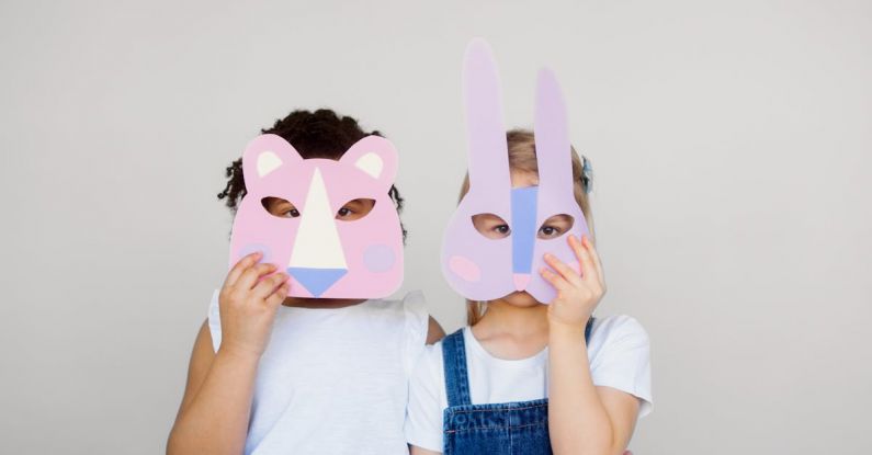 Educational Fun - Two Kids Covering Their Faces With a Cutout Animal Mask