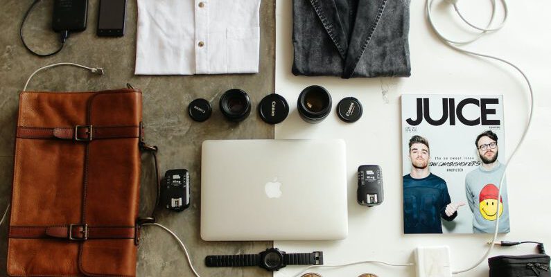 Essentials - Brown Leather Bag, Clothes, and Macbook
